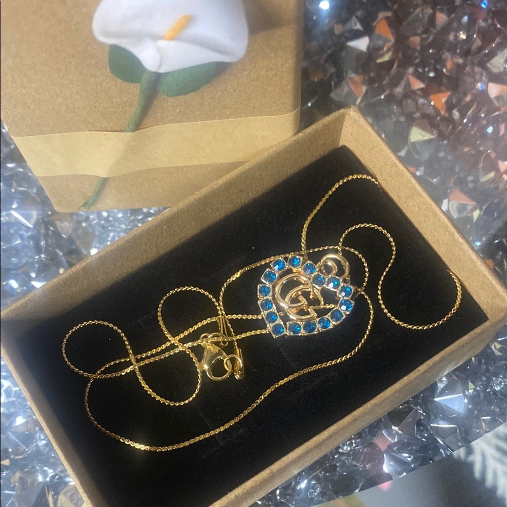 Gucci Gold Necklace with Blue Gemstone Heart Pendant